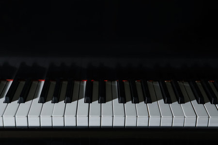 Classic piano as background, closeup. Musical instrument