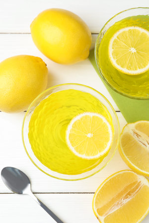 Lemon jelly on white wooden table, flat layの写真素材