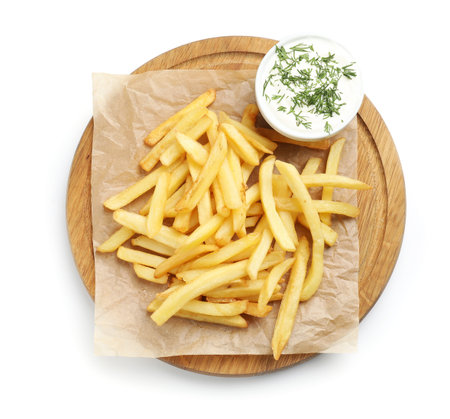 Tasty french fries with sauce isolated on white, top view