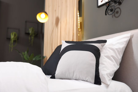 Soft pillows on bed in teenager's room, closeupの写真素材