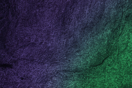 Neon lights on textured surface. Color gradient from green to purple