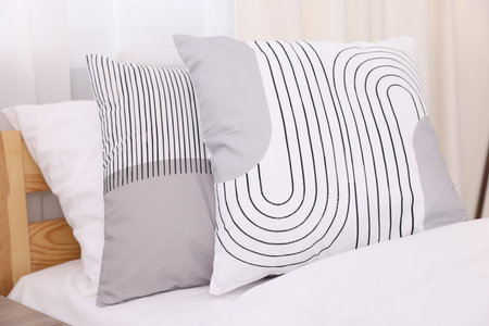 Comfortable bed in stylish child's room, closeup. Interior design