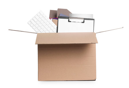 Dismissal. Box of personal office belongings isolated on white