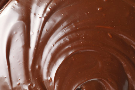 Texture of tasty melted chocolate as background, top view