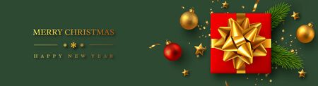 Christmas horizontal banner with realistic red gift box, baubles, pine branches and gold tinsel. New Year vector illustration.のイラスト素材