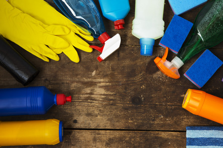 Cleaning products on wooden background. Home cleaning concept. Top view. From above. Copy space.の写真素材