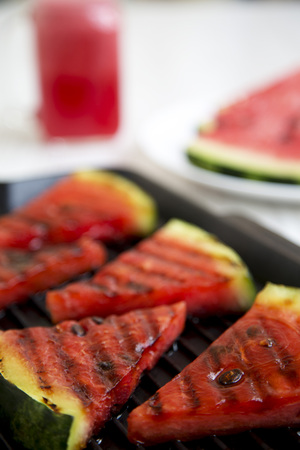 Grilled watermelon in grilling pan, close-up. Selective focus.の写真素材