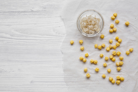Peeled chickpeas for cooking hummus, top view. Flat lay, from above. Copy space and text area.