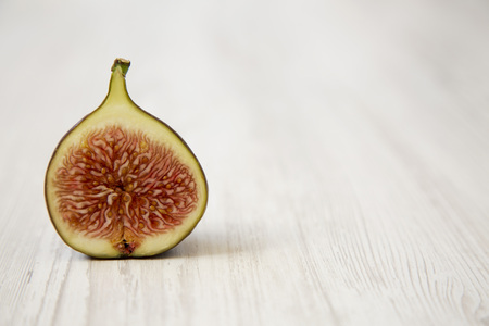 Half a fig, side view. Closeup. Copy space.の写真素材