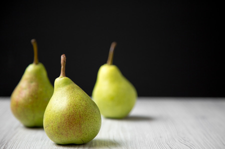 Fresh pears, side view. Copy space.
