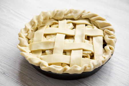 Apple pie on white wooden background, low angle view. Closeup.の写真素材