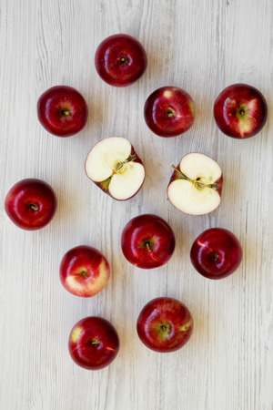 Raw red apples on white wooden table, overhead view. Flat lay, from above, top view. Close-up.の写真素材