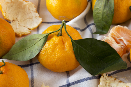 Fresh ripe tangerines on cloth, side view. Close-up.の写真素材