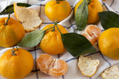 Fresh ripe tangerines on cloth, side view. Closeup.の写真素材