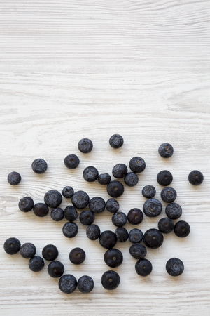 Top view, blueberries on a white wooden background. Copy space.の写真素材