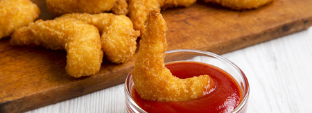 Fried shrimps tempura with sauce, side view. Close-up.の写真素材