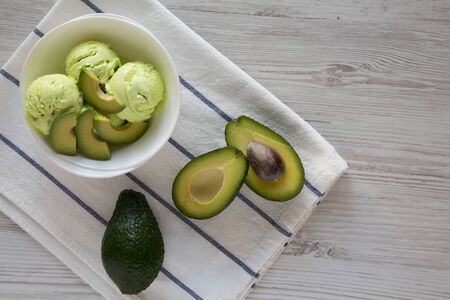 Homemade avocado ice cream in a bowl, overhead view. Top view, flat lay, from above. Copy space.の写真素材