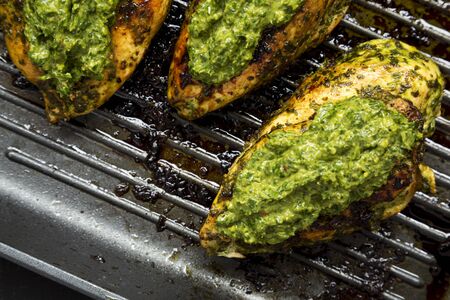 Grilled chimichurri chicken breast in a grilling pan, overhead view. Flat lay, top view, from above. Close-up.の写真素材