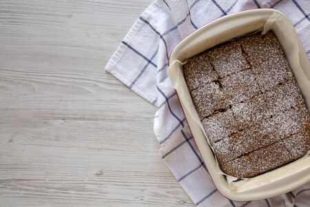 Homemade Tasty Applesauce Cake on a white wooden surface, top view. Flat lay, overhead, from above. Copy space.の写真素材