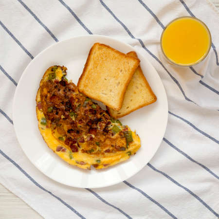 Homemade Denver Omelette on a white plate on cloth, overhead view. Flat lay, top view, from above.の写真素材