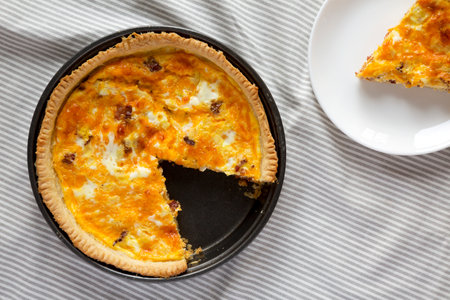 Homemade Bacon Quiche with Eggs and Cheddar Cheese, top view. Flat lay, overhead, from above.の写真素材