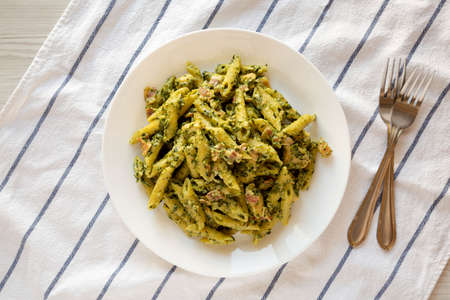 Homemade One-Pot Chicken Spinach Bacon Alfredo Pasta Ready to Eat, top view. Flat lay, overhead, from above.の写真素材