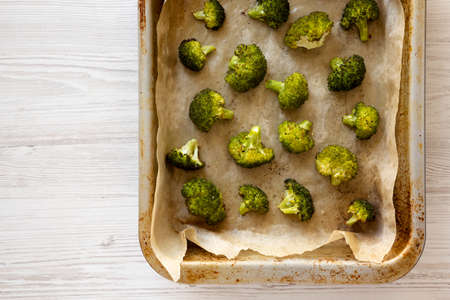 Homemade Roasted Broccoli with Salt and Pepper, top view. Flat lay, from above, overhead. Copy...