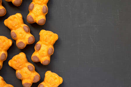 Homemade Sweet Cookies on a black surface, top view. From above, flat lay, overhead. Space for text.