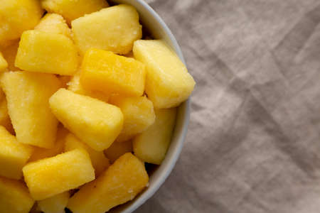 Organic Frozen Pineapple Slices in a Bowl, top view. Flat lay, overhead, from above. copyspace.の写真素材