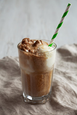 Homemade Ice Cream Float with Cola. Sweet Refreshment Drink, side view.