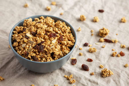 Homemade Granola with raisins and almonds in a Bowl, side view.の写真素材