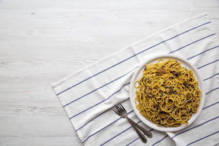 Homemade Spinach Mushroom Pesto Spaghetti on a Plate, overhead view. Flat lay, top view, from above. copyspace.の写真素材