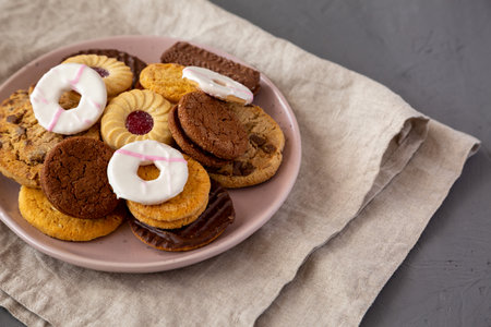 Variety of Biscuits on a pink Plate, top view. Flat lay, overhead, from above.の写真素材