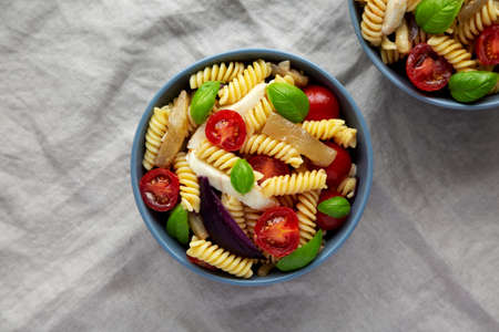 Homemade Fusilli Pasta Salad with Mozzarella and Vegetables, top view. Flat lay, overhead, from above.の写真素材
