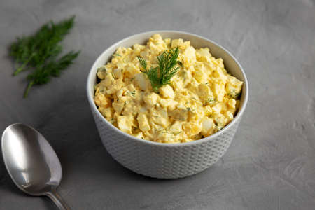 Homemade Egg Salad with Dill in a Bowl, side view.の写真素材