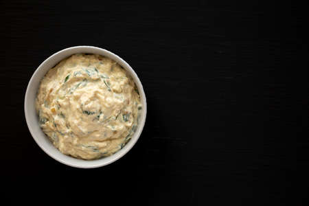 Homemade Caramelized Onion and Spinach Dip, top view. Flat lay, overhead, from above.の写真素材