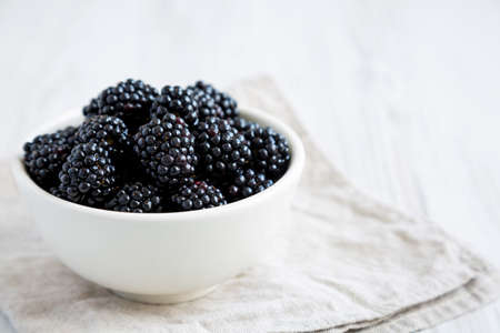 Raw Blackberries in a Bowl, side view. Space for text.の写真素材
