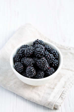 Raw Blackberries in a Bowl, side view.