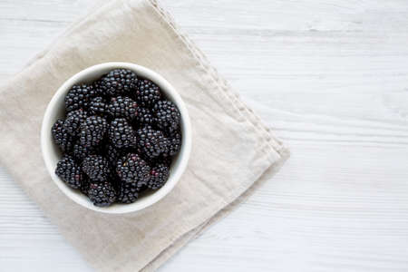 Raw Blackberries in a Bowl, top view. Flat lay, overhead, from above. copyspace.の写真素材