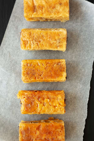 Homemade Baklavas with Honey, Chocolate and Almond on a black background, top view. Flat lay, overhead, from above.の写真素材