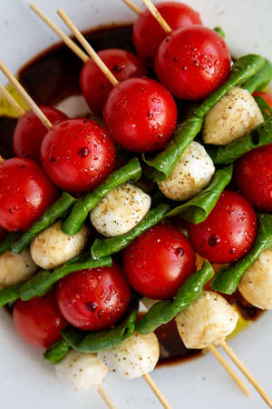 Homemade caprese skewer appetizer on a plate, top view. Flat lay, overhead, from above. close-up.の写真素材