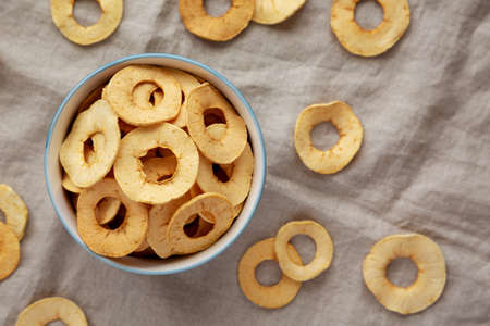 Homemade apple chips in a bowl, top view. Flat lay, overhead, from above.の写真素材