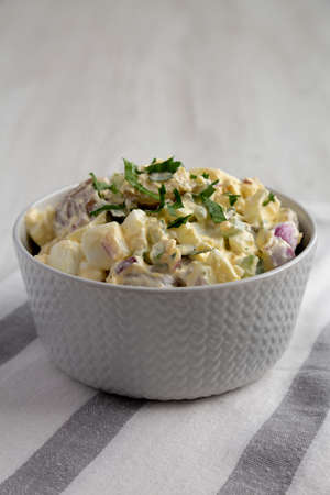 Homemade Healthy Potato Salad with Eggs in a Bowl, side view.の写真素材