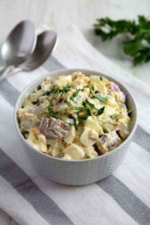Homemade Healthy Potato Salad with Eggs in a Bowl, side view.の写真素材