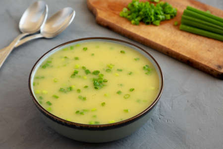 Homemade Potato Leek Soup in a Bowl on a gray background, low angle view.の写真素材