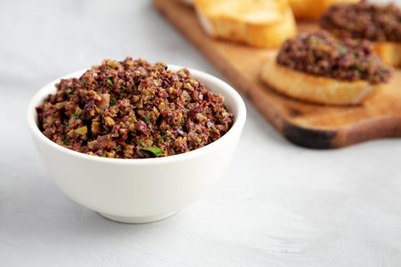 Homemade Mixed Olive Tapenade in a Bowl, side view.の写真素材