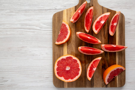 Organic Red Ruby Grapefruit on a Wooden Board, top view. Overhead, from above, flat lay. copyspace.の写真素材