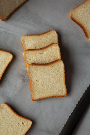 Sliced Whole Wheat White Bread on a gray background, top view. Flat lay, overhead, from above.