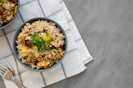 Homemade Fried Rice with Bacon and Egg in a Bowl, top view. Flat lay, overhead, from above. Space for text.の写真素材