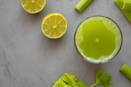 Refreshing Organic Celery Juice with Lime in a Glass, top view. Flat lay, overhead, from above. copyspace.の写真素材